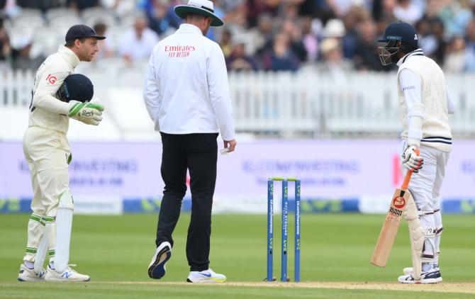 Jasprit Bumrah exchanges words with England wicketkeeper Jos Buttler.