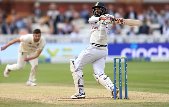 Jasprit Bumrah hits a short delivery from Mark Wood to the boundary.