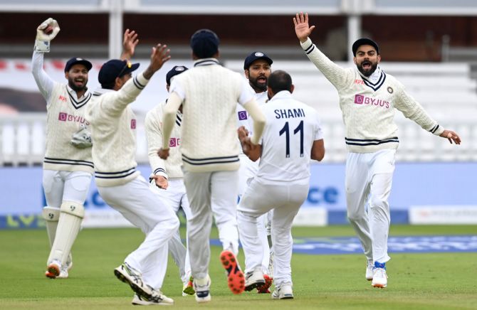 India's players celebrate after Dom Sibley is dismissed for a 'duck' in England's second innings.