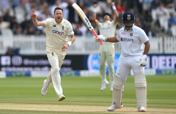 England bowler Ollie Robinson celebrates after taking the wicket of Rishabh Pant.