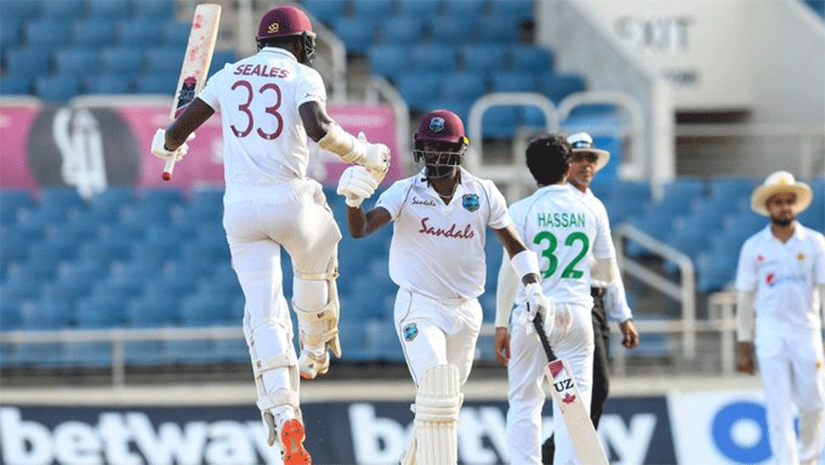 West Indies' Kemar Roach celebrates with Jayden Seales after scoring the match-winning runs in the first Test against Pakistan in Kingston, Jamaica on Sunday