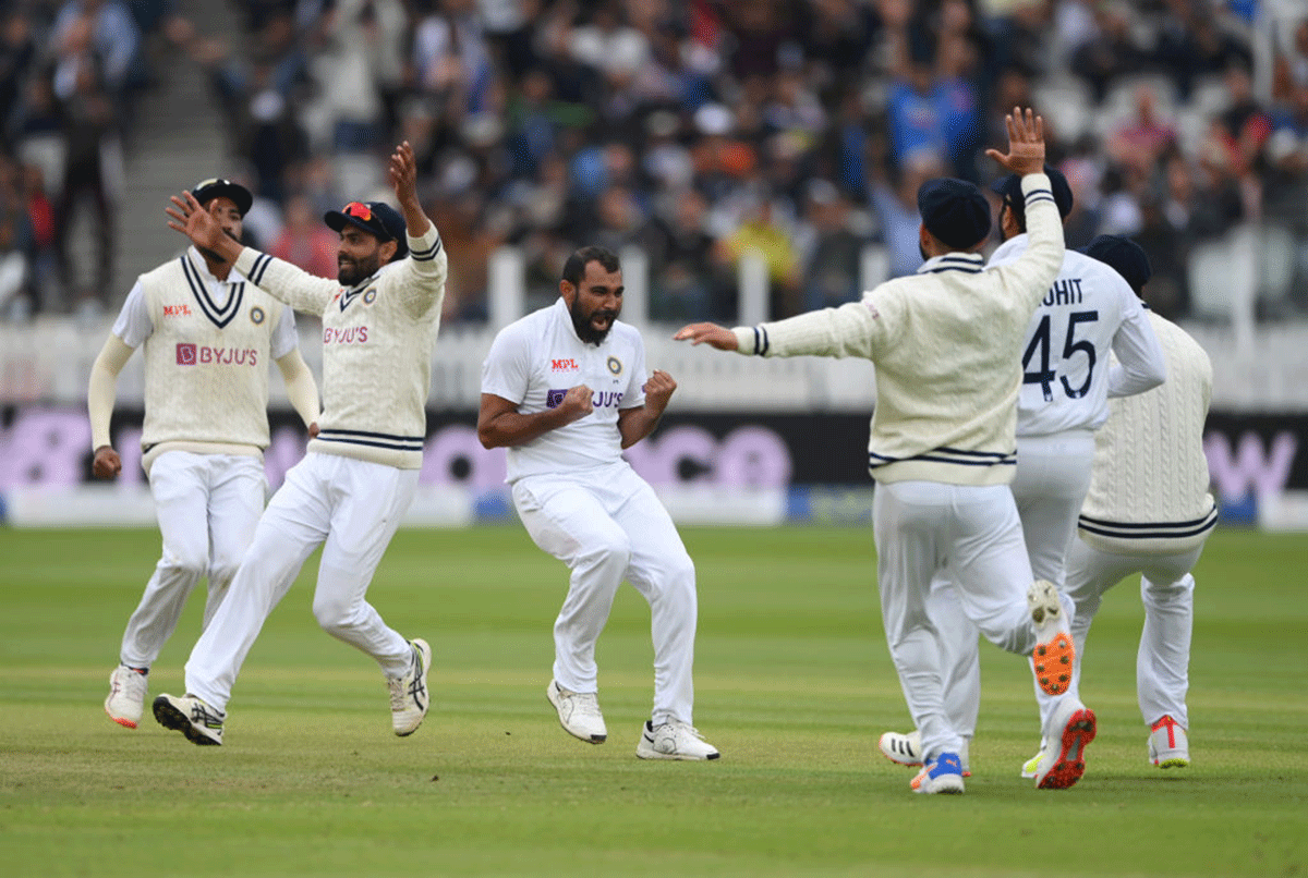 India's bowler Mohammed Shami celebrates after taking the wicket of Dom Sibley on Day 5 of the second Test at Lord's Cricket Ground in London on Monday