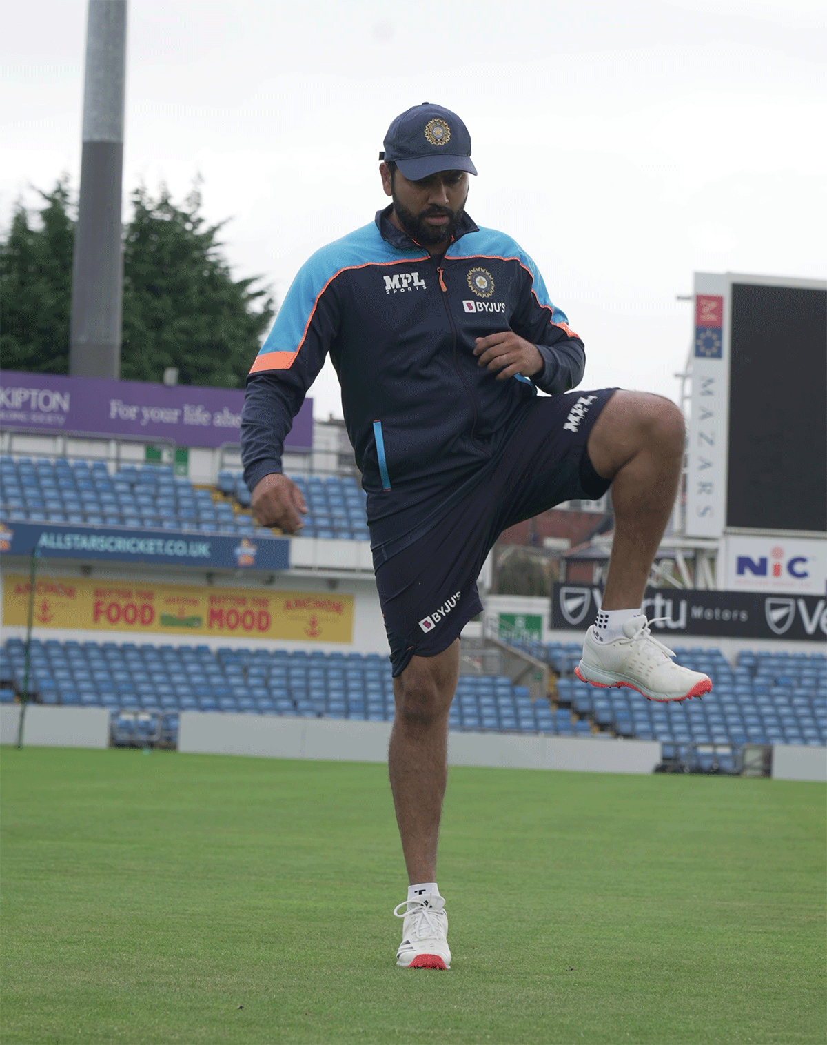 Rohit Sharma warms up before hitting the nets