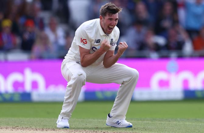 Craig Overton celebrates after dismissing Rohit Sharma.