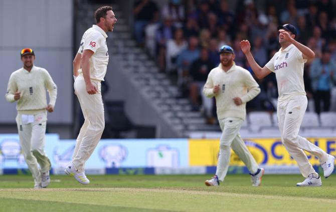 England pacer Ollie Robinson celebrates taking the wicket of India's Rishabh Pant.