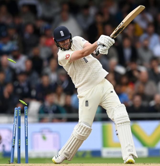 England's Ollie Robinson is bowled by India pacer Jasprit Bumrah.