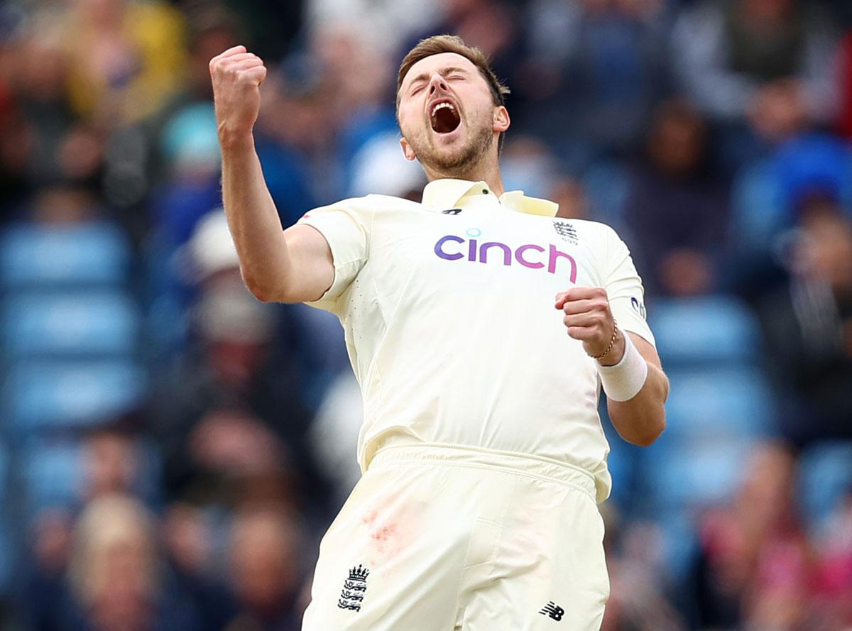 England pacer Ollie Robinson celebrates after capturing the wicket of Rohit Sharma.