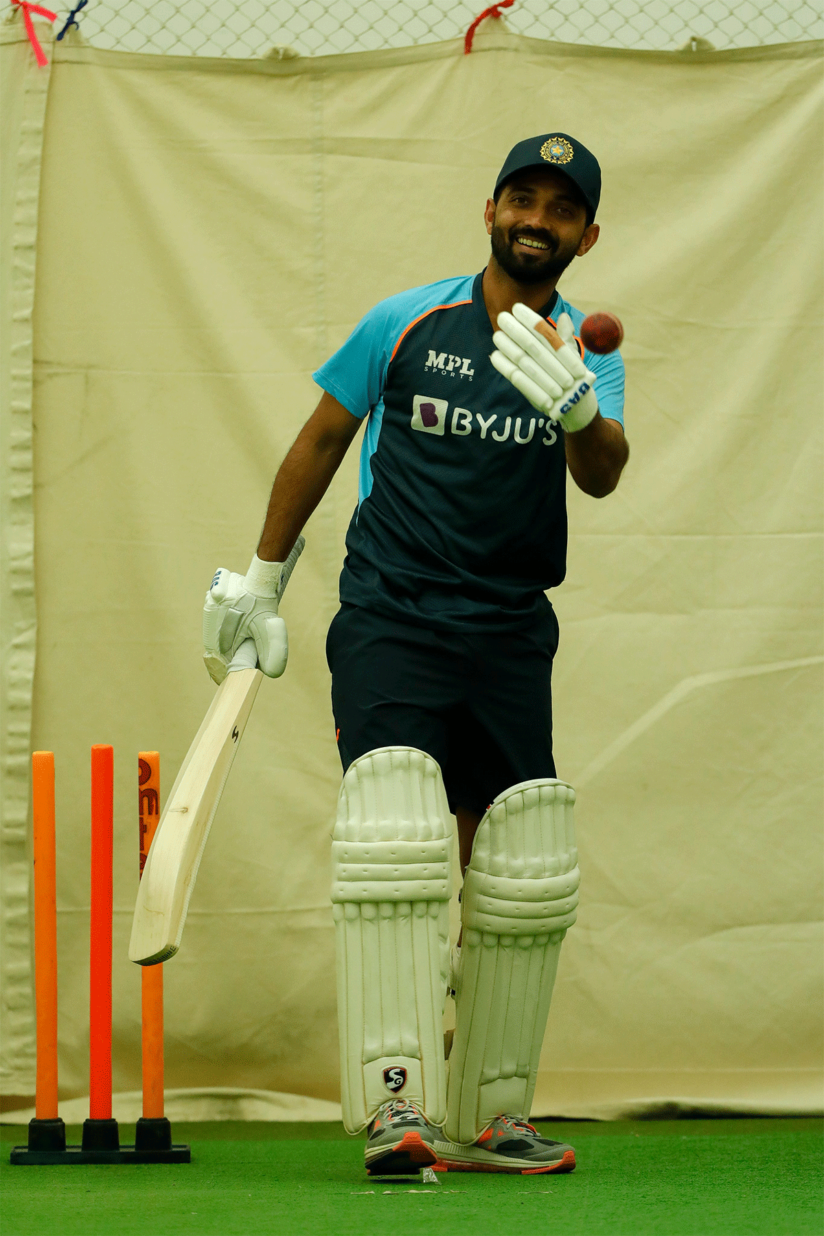 Ajinkya Rahane all smiles during training on Thursday.  Rahane, has supposedly sustained what was described as a "minor left hamstring strain" while fielding on the final day of the first Test match in Kanpur.