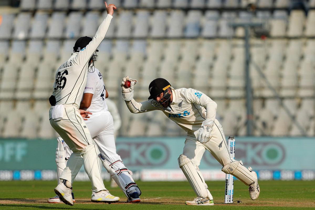 Wicketkeeper Tom Blundell of New Zealand taking a catch to dismiss Shreyas Iyer off Ajaz Patel's bowling