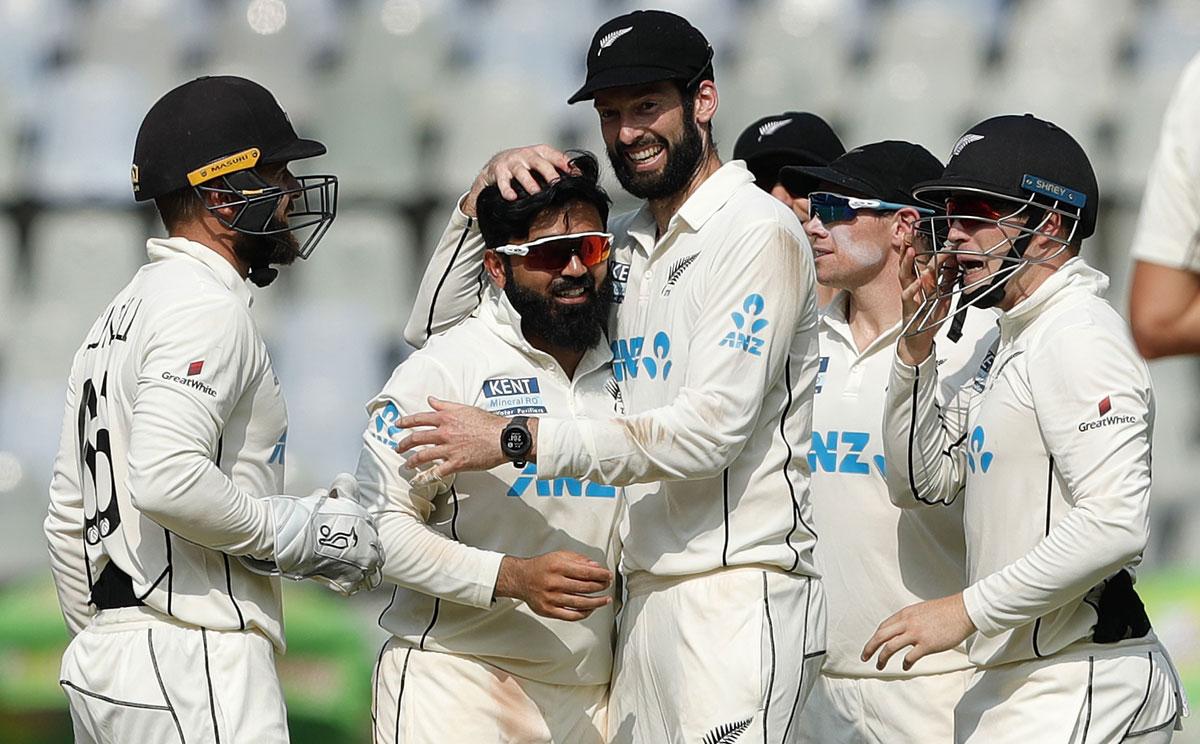 Ajaz Patel  celebrates with New Zealand's players after dismissing  Cheteshwar Pujara