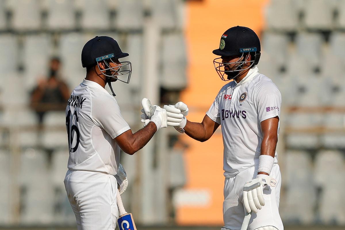 Mayank Agarwal and Shreyas celebrate a boundary.