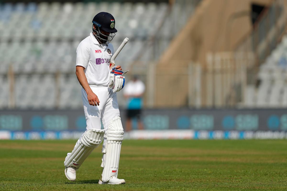 Virat Kohli walks back after being dismissed for a duck.