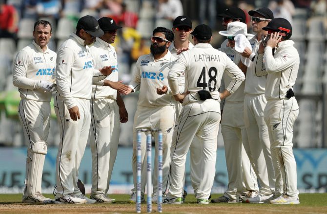 New Zealand's players celebrating the wicket of Cheteshwar Pujara