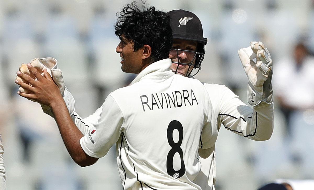 Rachin Ravindra celebrates the wicket of Virat Kohli.