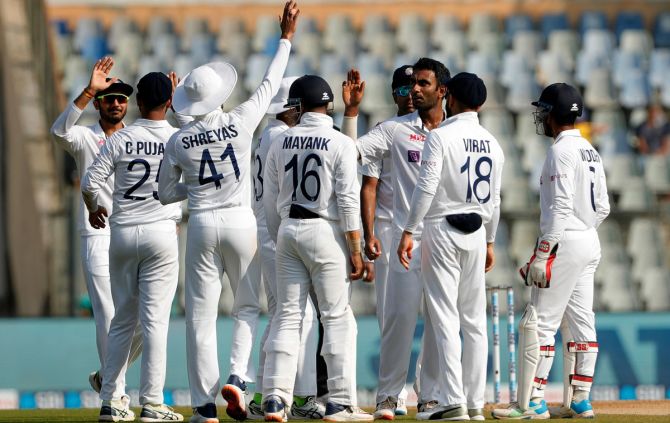 India's Jayant Yadav celebrates after dismissing New Zealand's Rachin Ravindra on Day 4 of the second Test, in Mumbai, on Monday.