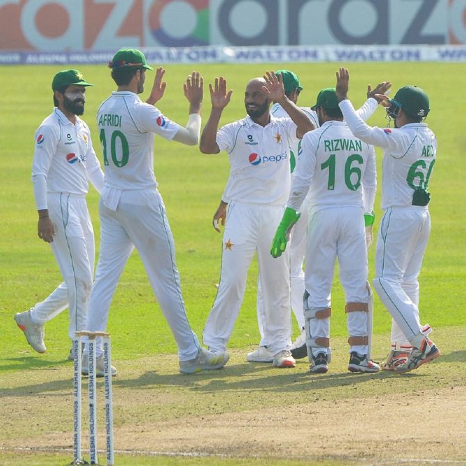 IMAGE: Pakistan spinner Sajid Khan (centre) celebrates with his teammates. Photograph: PCB
