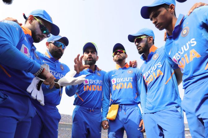 Virat Kohli in a huddle with Team India