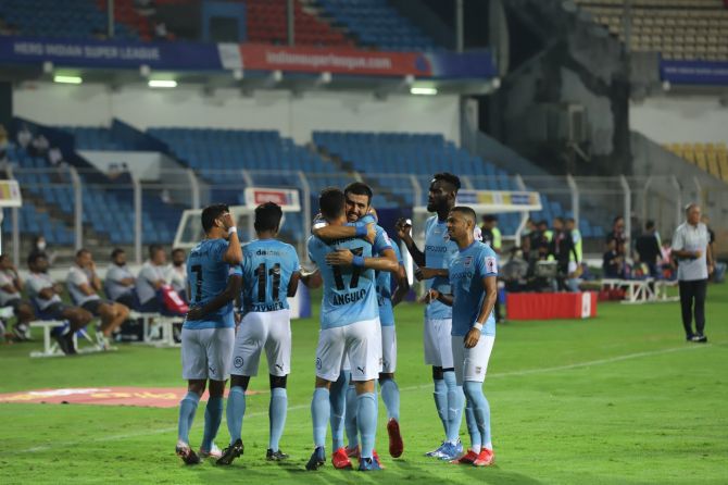 Mumbai City's players celebrate after beating Jamshedpur FC in Goa on Thursday.
