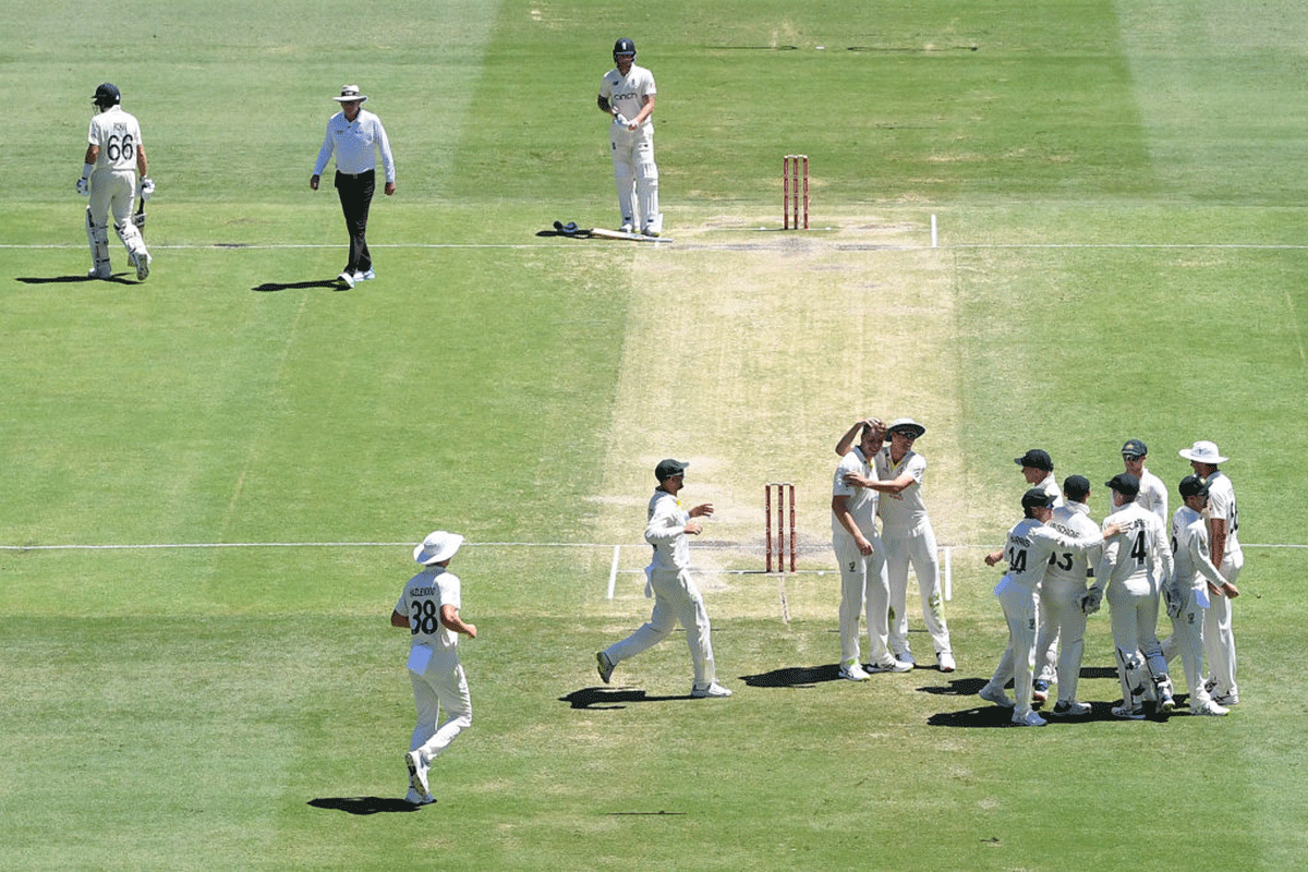 Cameron Green celebrates taking the wicket of Joe Root at The Gabba on Saturday. 