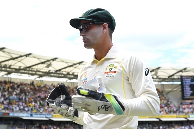 Alex Carey took a record eight catches in the Brisbane Test.