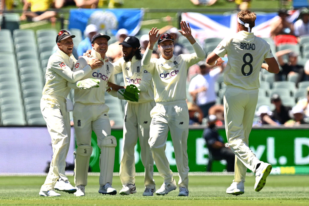 England's Stuart Broad (right) celebrates with Jos Buttler, who took a fine catch behind the stumps, to dismiss Australia's Marcus Harris cheaply