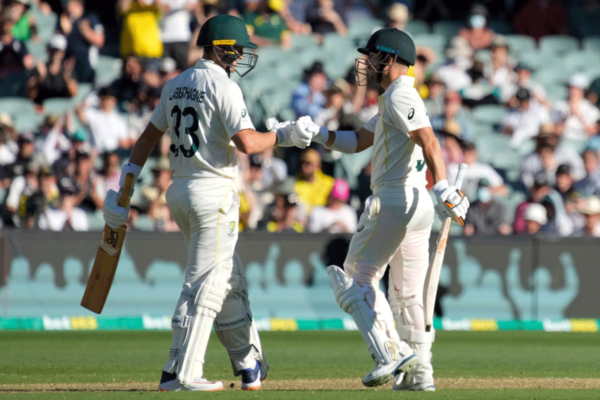 Australia's Marnus Labuschagne congratulates David Warner on completing his half-century on Thursday