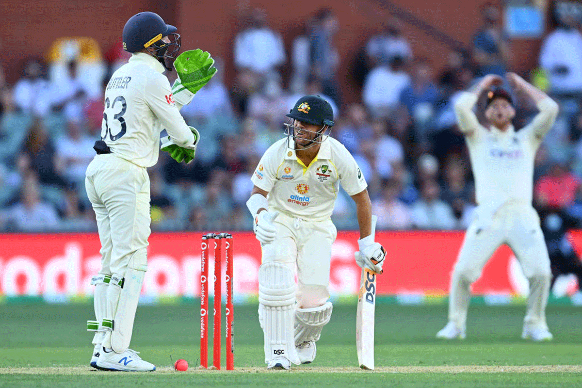 David Warner is nearly bowled during a failed attempt at a reverse sweep