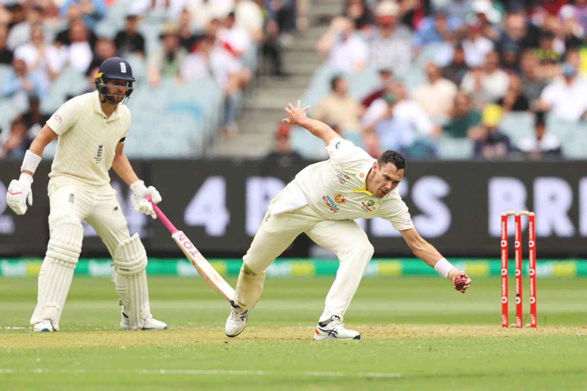 Test Debutant Scott Boland fields off his own bowling. 