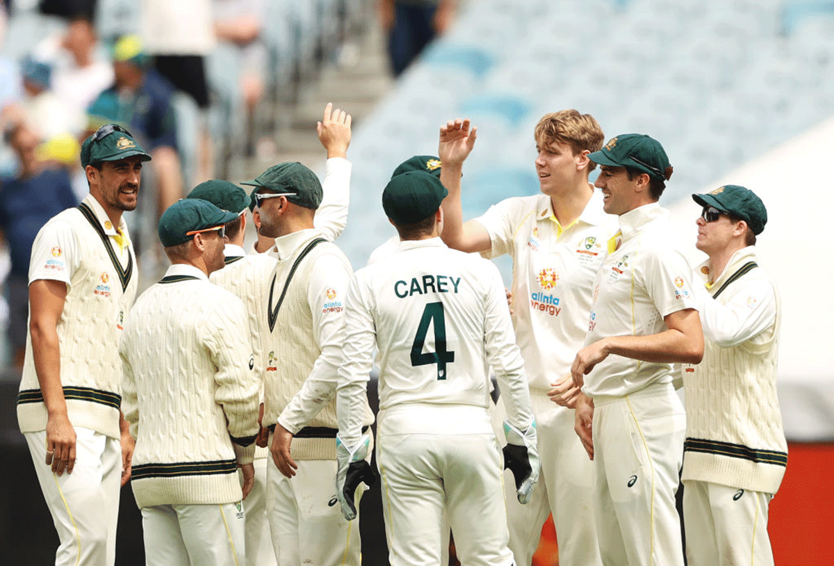Cameron Green celebrates with teammates after dismissing Ben Stokes