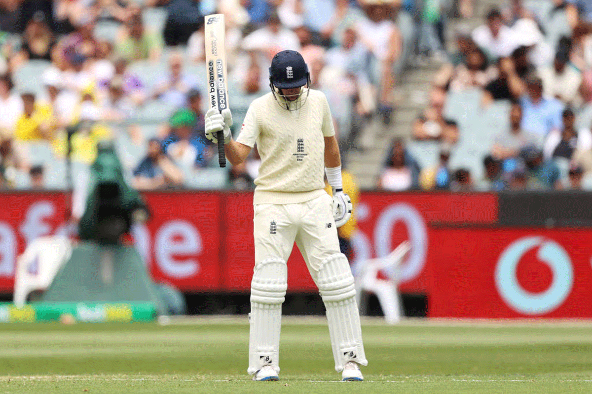 Joe Root acknowledges the crowd on completing his half-century