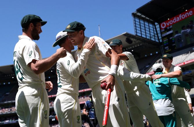 Scott Boland celebrates with teammates after destroying England with figures of 6 for 7 as Australia won the third Ashes Test, at the Melbourne Cricket Ground, on Tuesday.