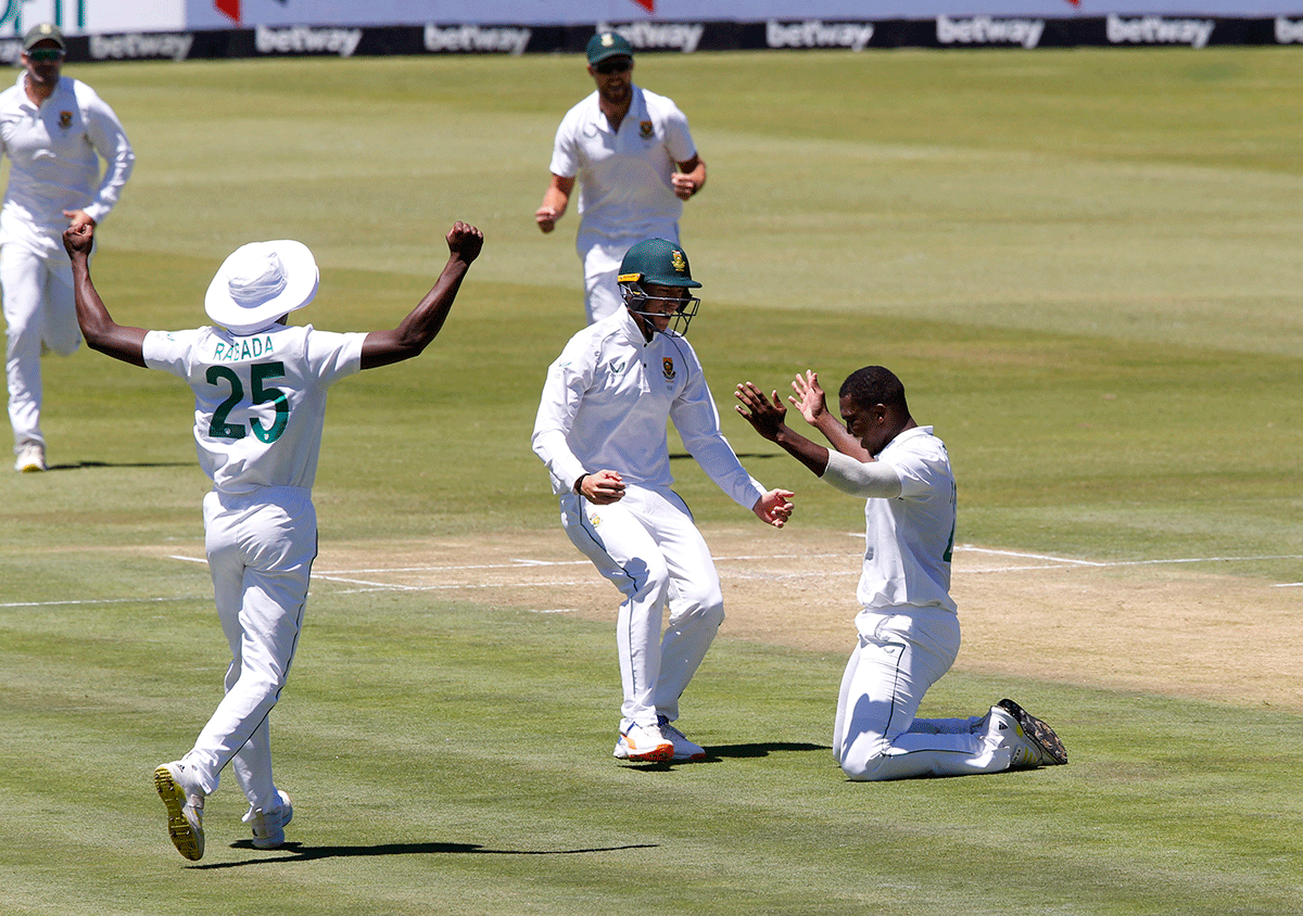 South Africa's Lungi Ngidi celebrates with teammates after picking the wicket of India's Rishabh Pant  