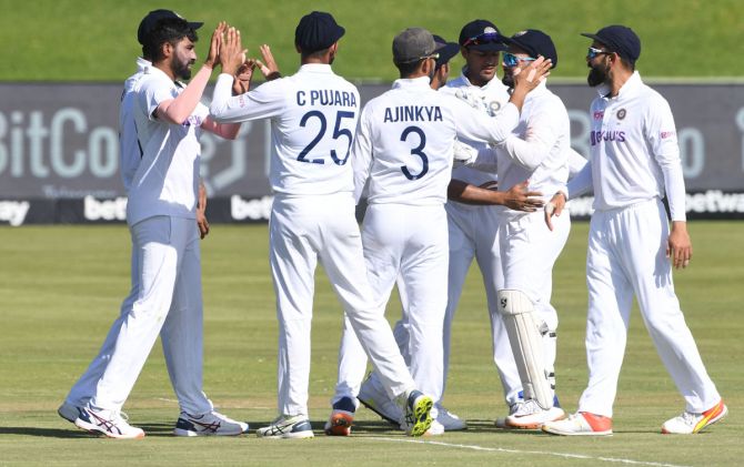 India's players celebrate the wicket of Keegan Petersen
