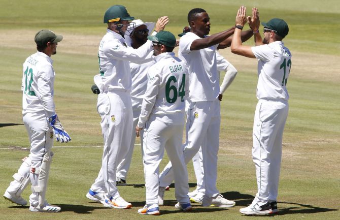 South Africa's Kagiso Rabada celebrates with teammates after  dismissing Shardul Thakur.