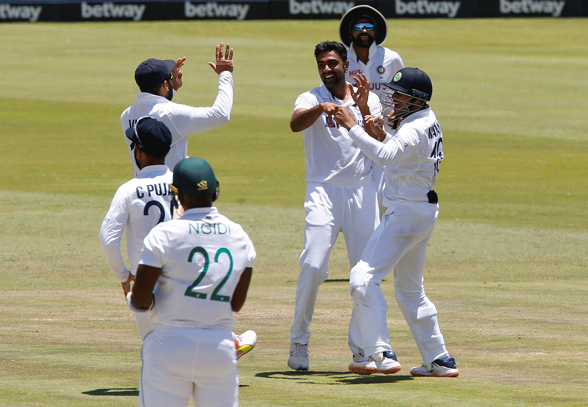 India's Ravichandran Ashwin celebrates after with teammates after taking the wicket of South Africa's Lungi Ngidi, to win the match