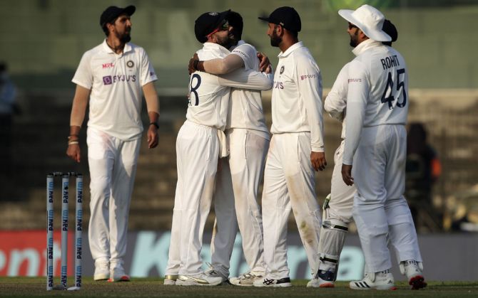 Jasprit Bumrah gets a hug from skipper Virat Kohli after trapping Dom Sibley leg before wicket at the fag end of Day 1