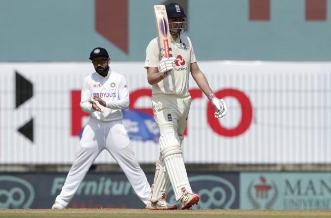 Dominic Sibley celebrates after scoring a fifty