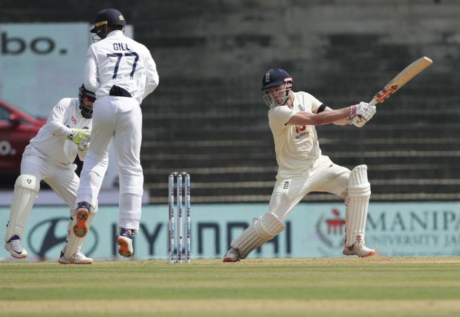 Dom Sibley sends the ball to the boundary.