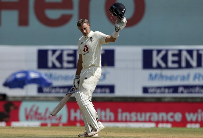 England's Joe Root celebrates completing 150 on Saturday, Day 2 of the first Test against India, at the M A Chidambaram stadium, in Chennai.  