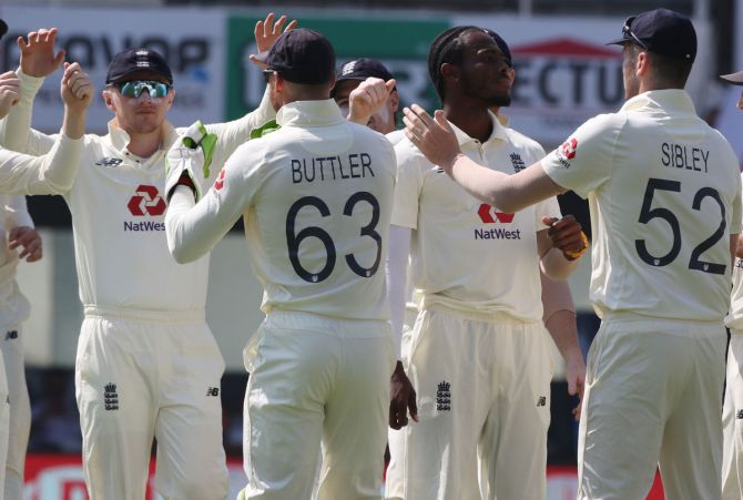 England's players celebrate after Jofra Archer dismisses India opener Rohit Sharma on Day 3 of the first Test.