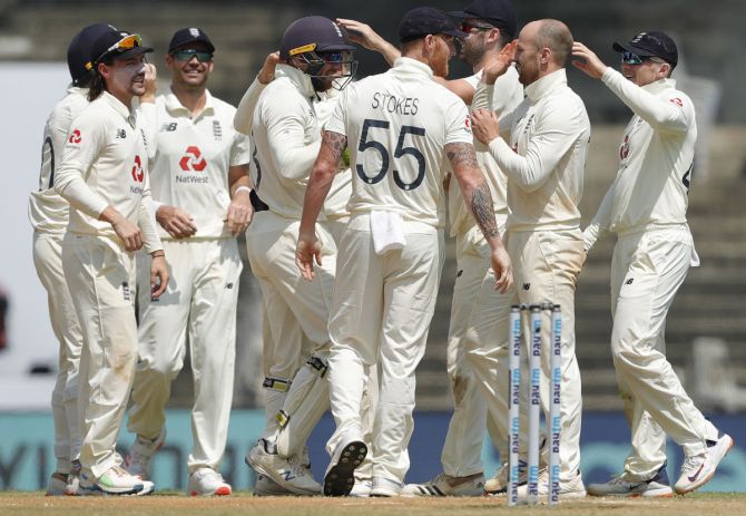 England's players celebrate the wicket of Ravichandran Ashwin