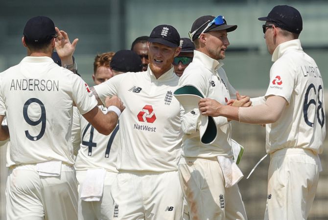 England's players celebrate victory over India in the first Test