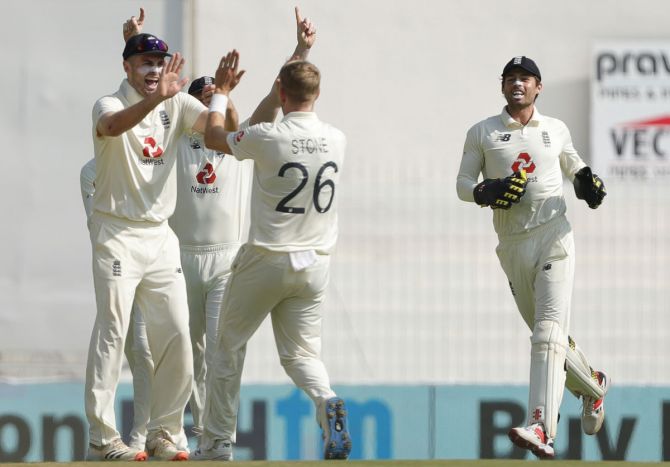 England's players celebrate the dismissal of Shubman Gill