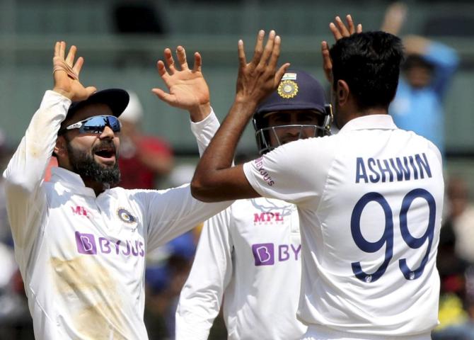  Ravichandran Ashwin celebrates with Virat Kohli after dismissing Ben Stokes