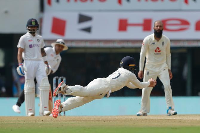 Moeen Ali watches anxiously as Ollie Pope take the catch to dismiss Ajinkya Rahane.