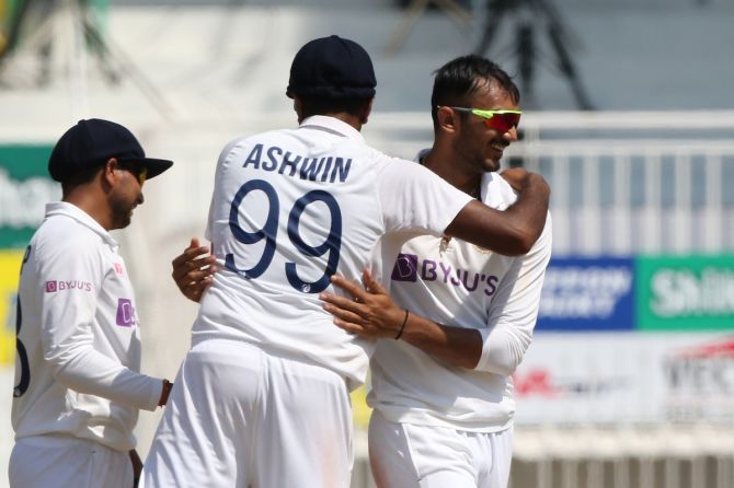 Axar Patel celebrates with Ravichandran after dismissing Ollie Pope. 