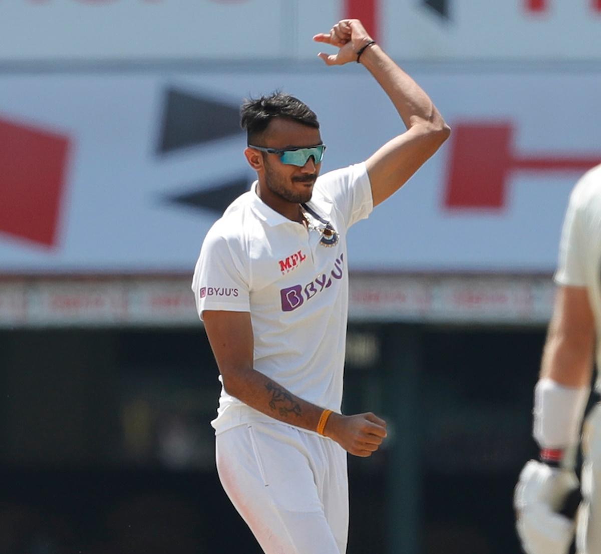 Axar Patel celebrates after dismissing Joe Root