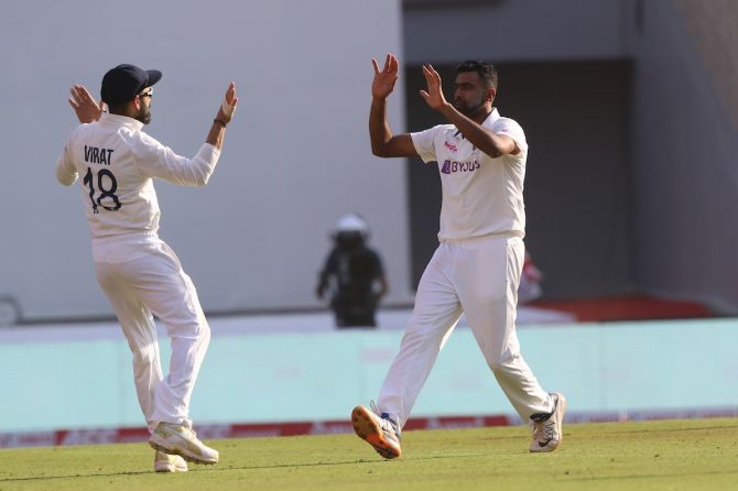 Ravichandran Ashwin gets a high-five from skipper Virat Kohli after dismissing Ollie Pope