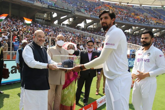 Ishant Sharma receives a momento from Home Minister Amit Shah ahead of the 3rd Test in Ahmedabad on Wednesday 