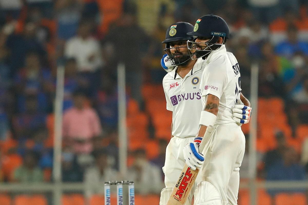 Rohit Sharma is congratulated by skipper Virat Kohli after completing his half-century.